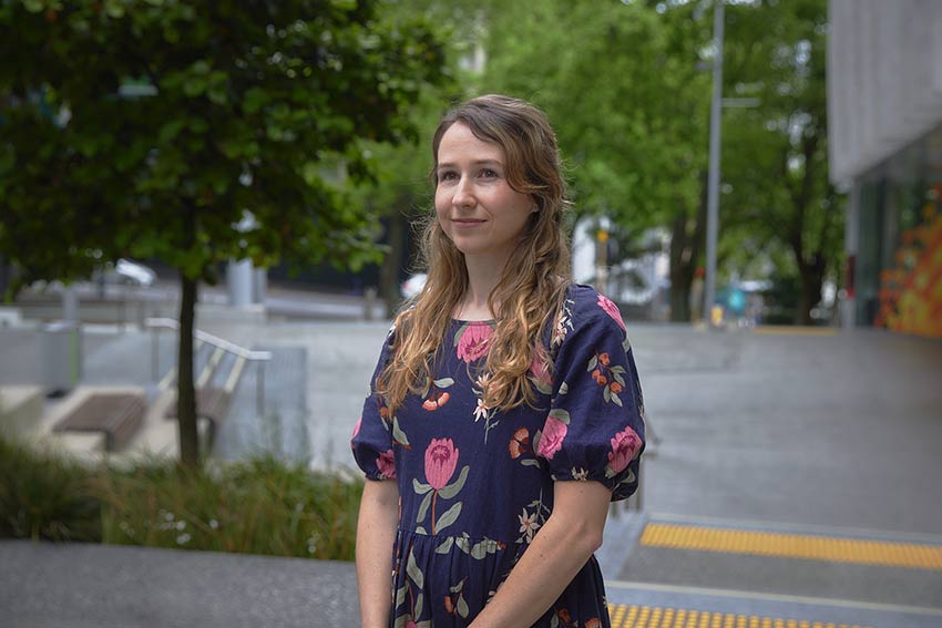 Senior Lecturer Priscila Besen smiling for photo outside of AUT City Campus.